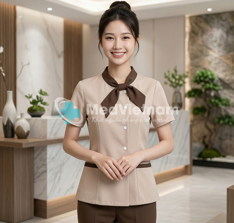 Quần áo đồng phục quản lý spa màu da phối nâu thiết kế nơ cổ.